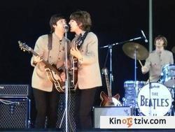 Смотреть фото The Beatles at Shea Stadium.